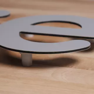 Side view of an aluminum composite letter with black core order now