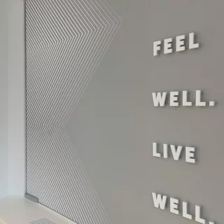 Combination of a painted wall and an acrylic glass logo