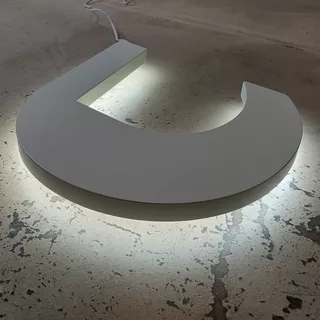 Backlit LED logo element with neutral white light color