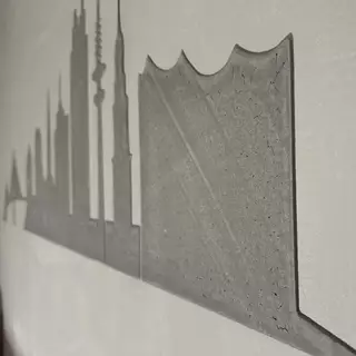 Eine verputzte Stadt Silhouette aus Beton an der Wand - Metallschablone